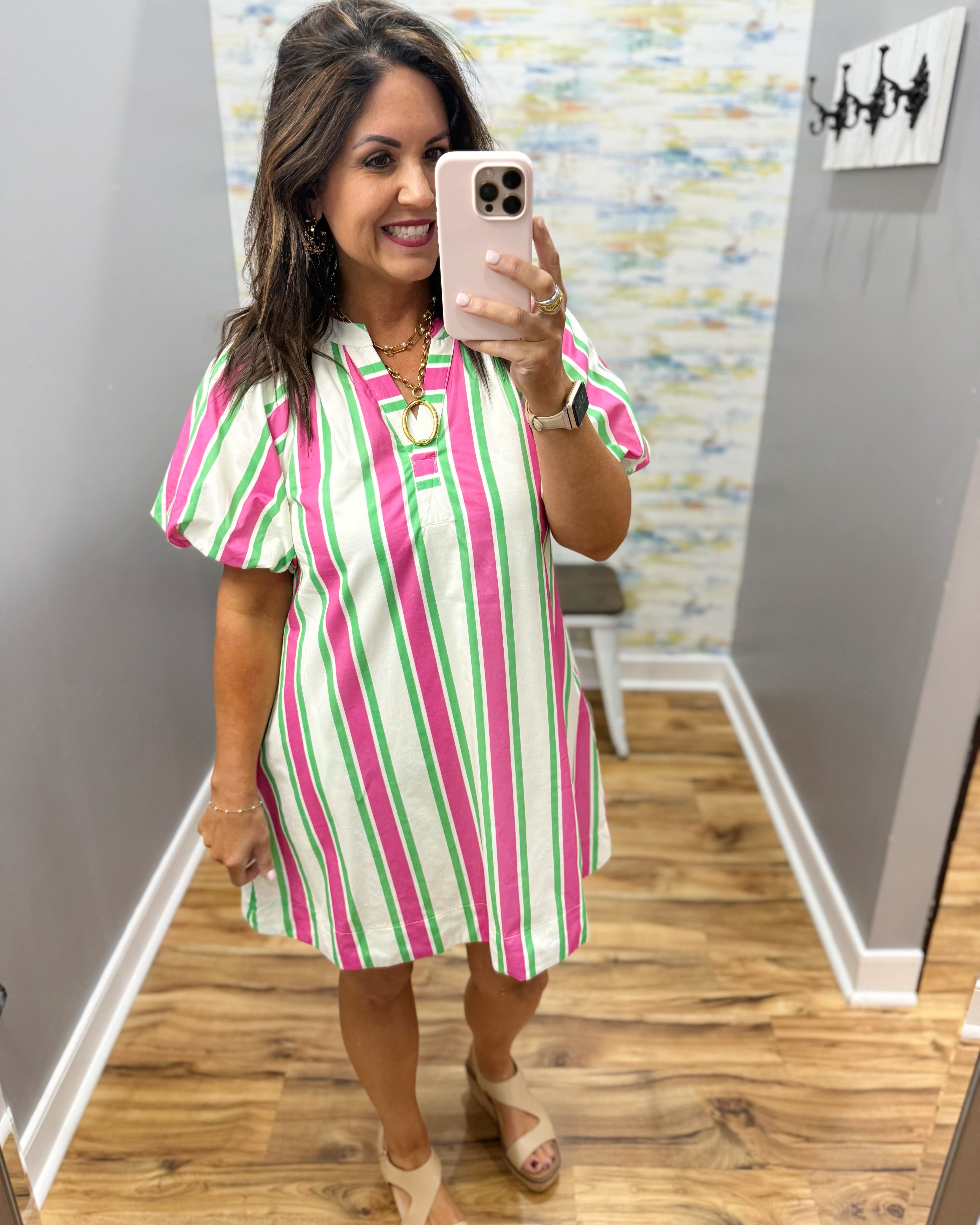 woman wearing a stripe dress.