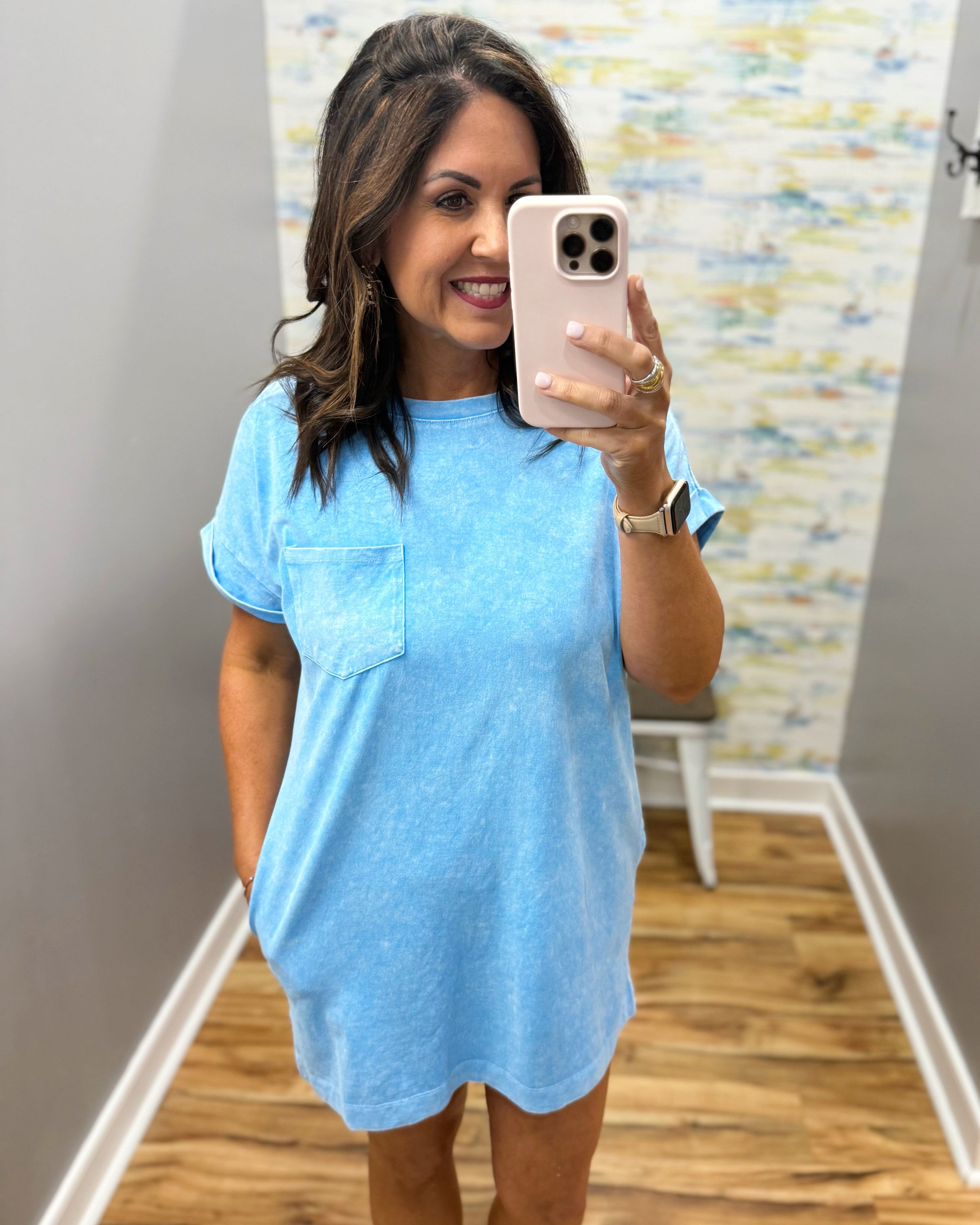 woman wearing deep sky blue t-shirt dress with sandals. 