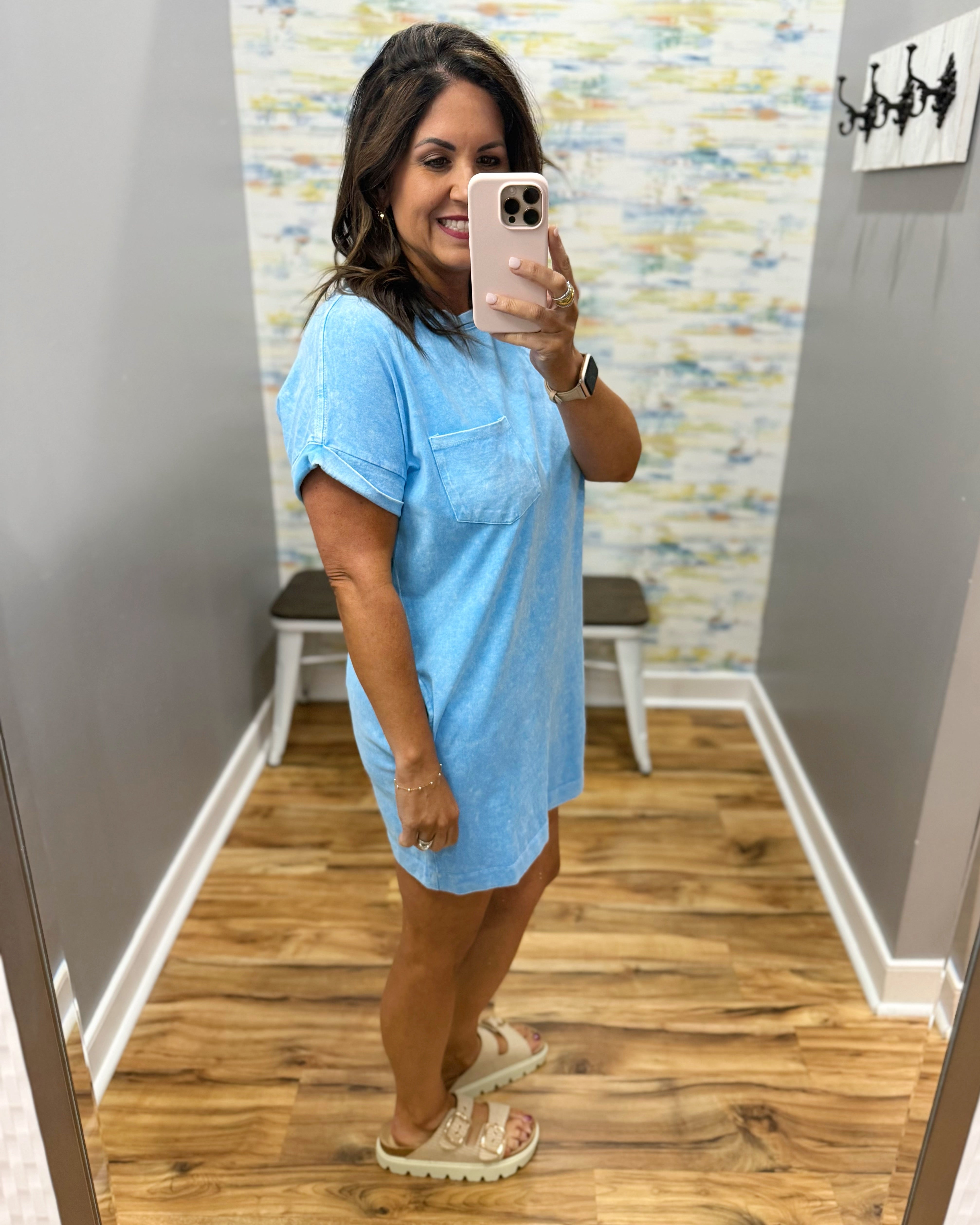 woman wearing deep sky blue t-shirt dress with sandals. 