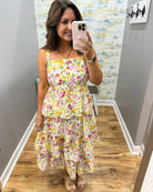 woman wearing floral maxi dress.