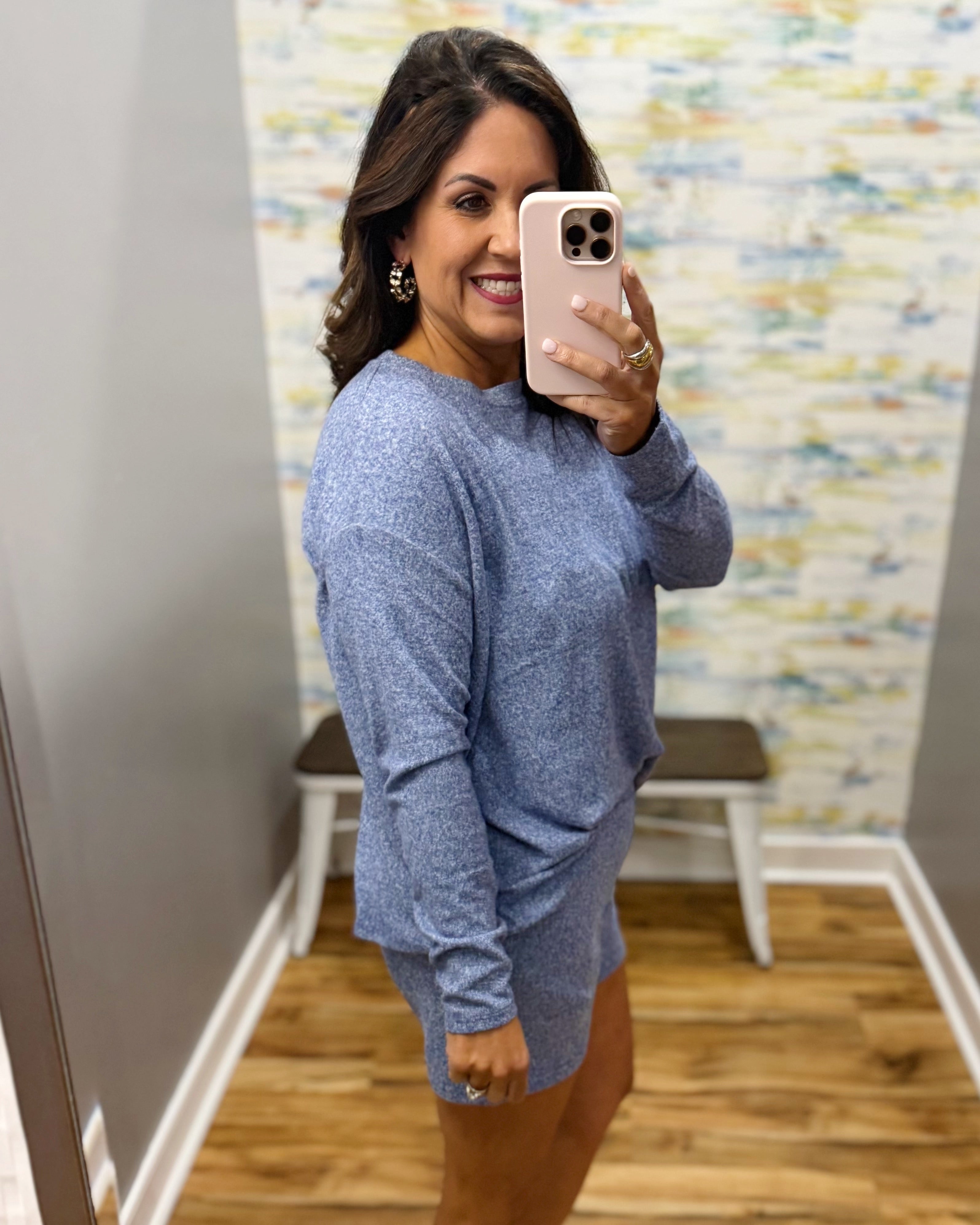 woman wearing light navy lounge top and shorts set.