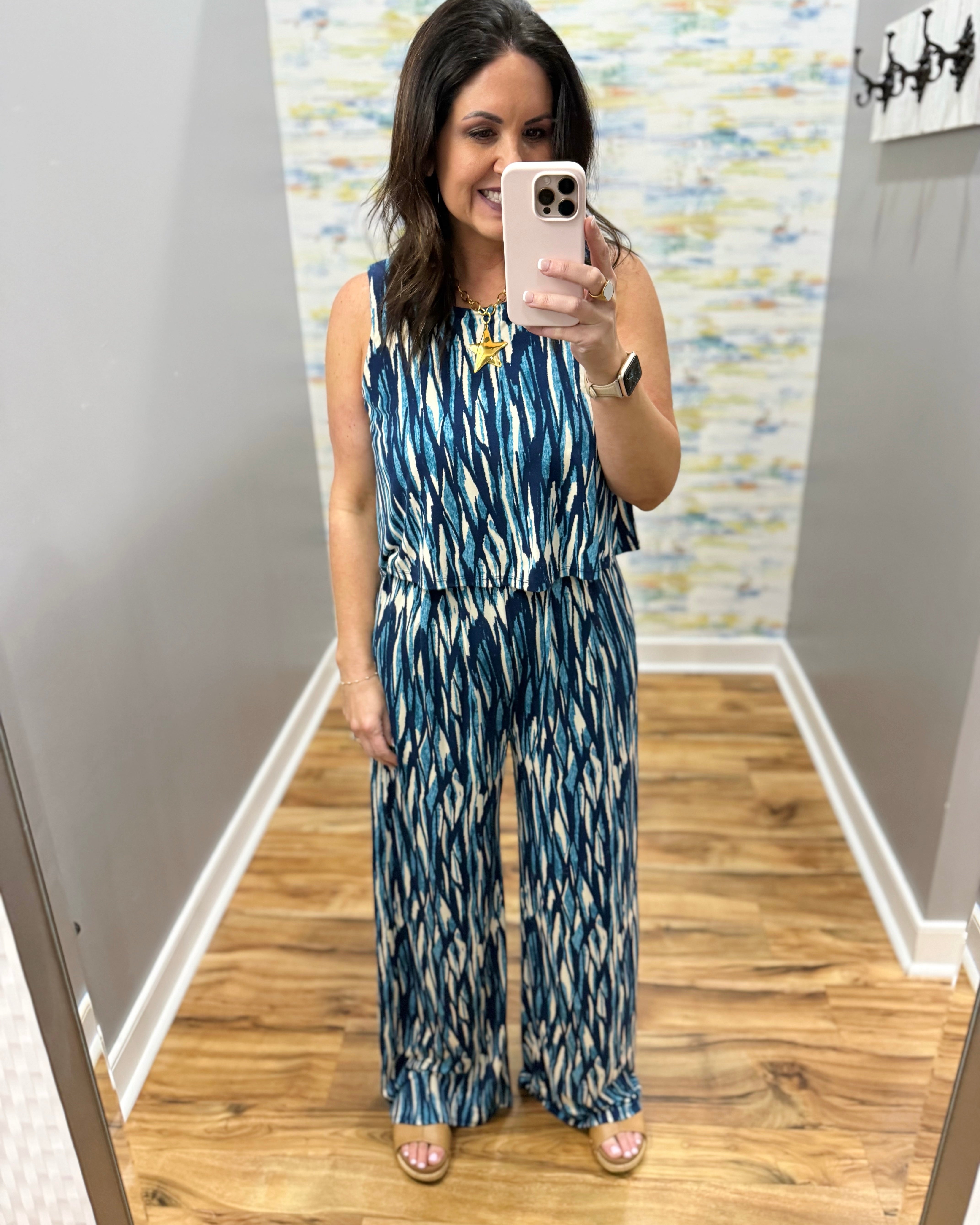 woman wearing navy and white jumpsuit