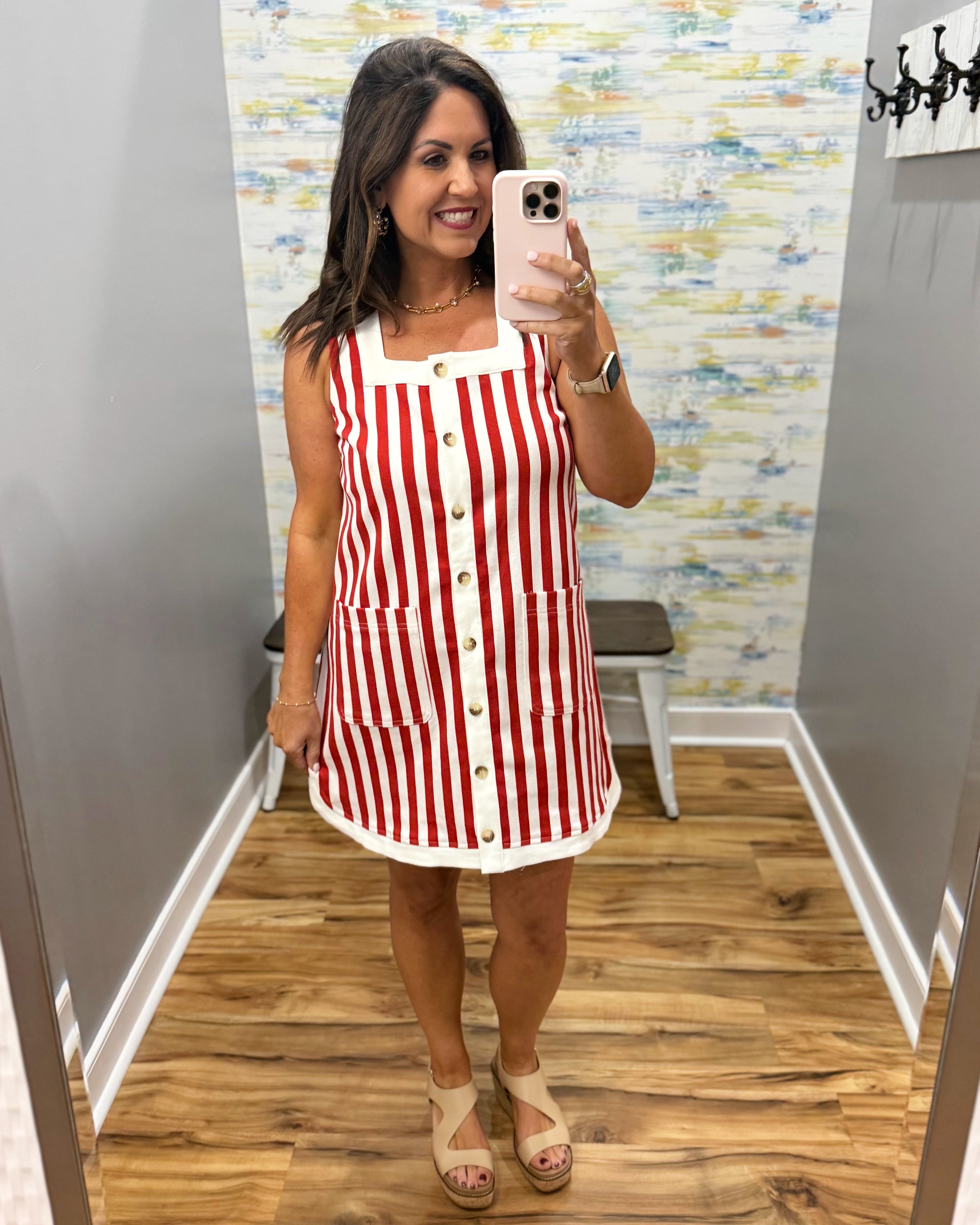 woman wearing red and white stripe dress.
