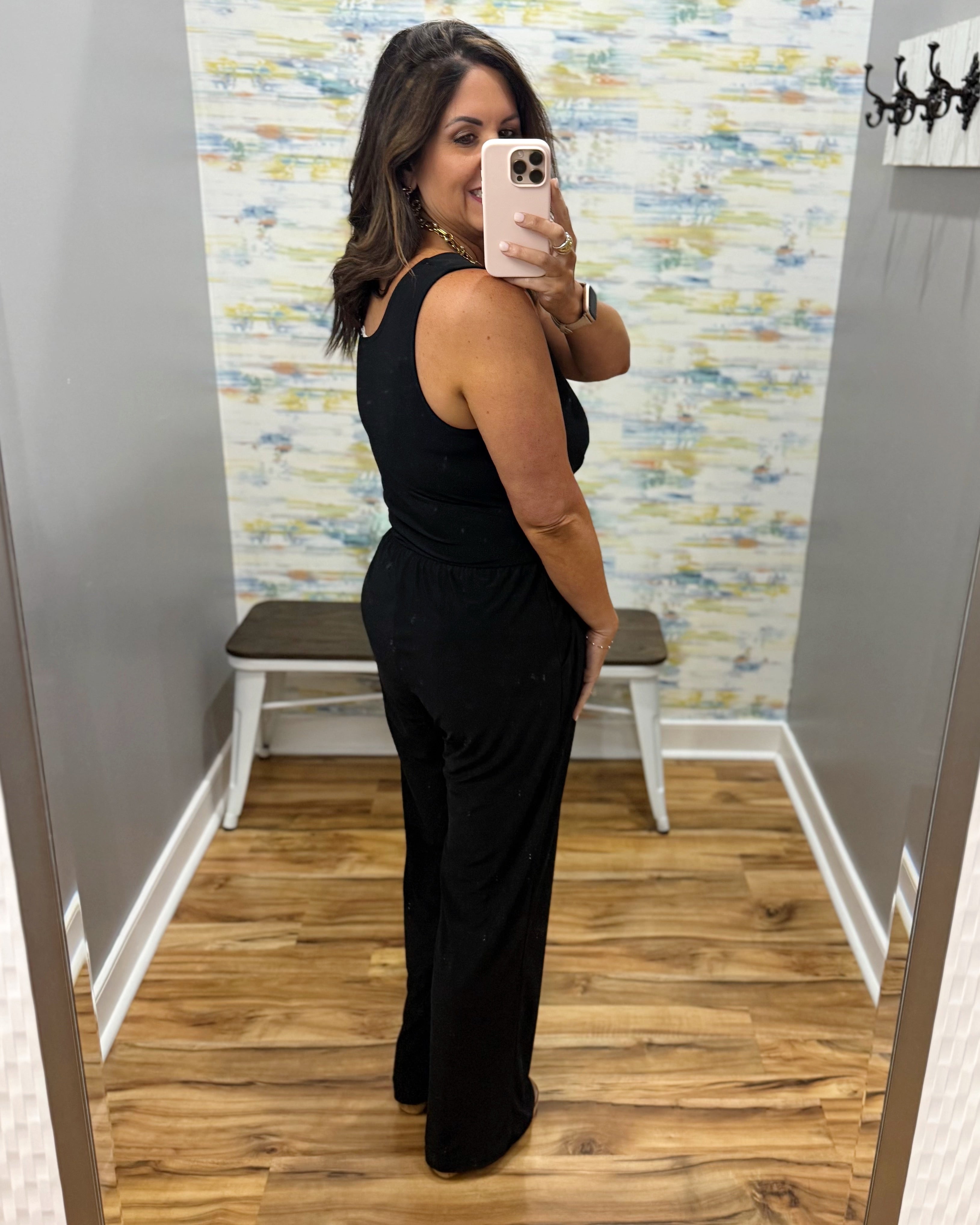 woman wearing a black jumpsuit