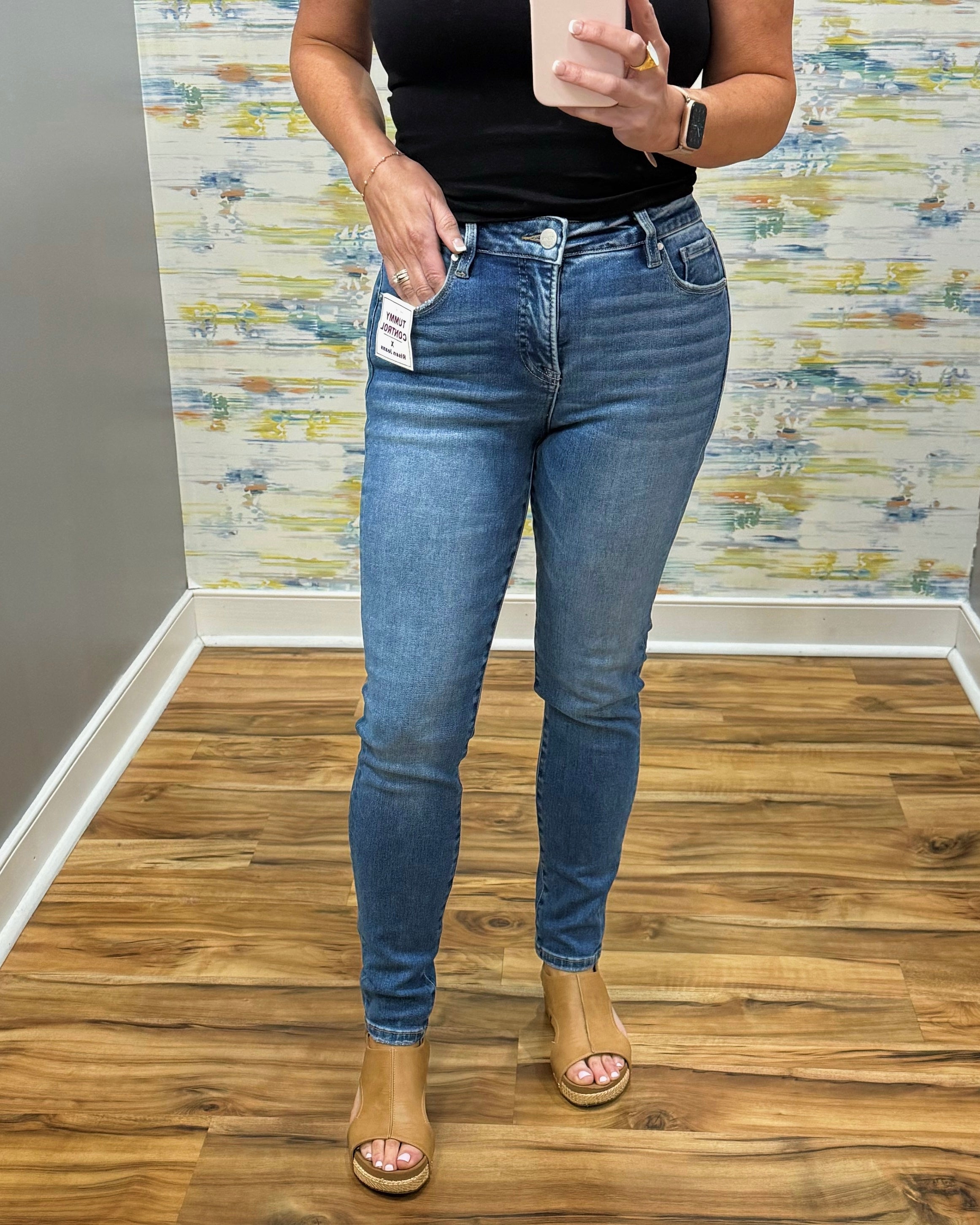 woman wearing Risen Medium Wash Tummy Control Skinny Jeans.