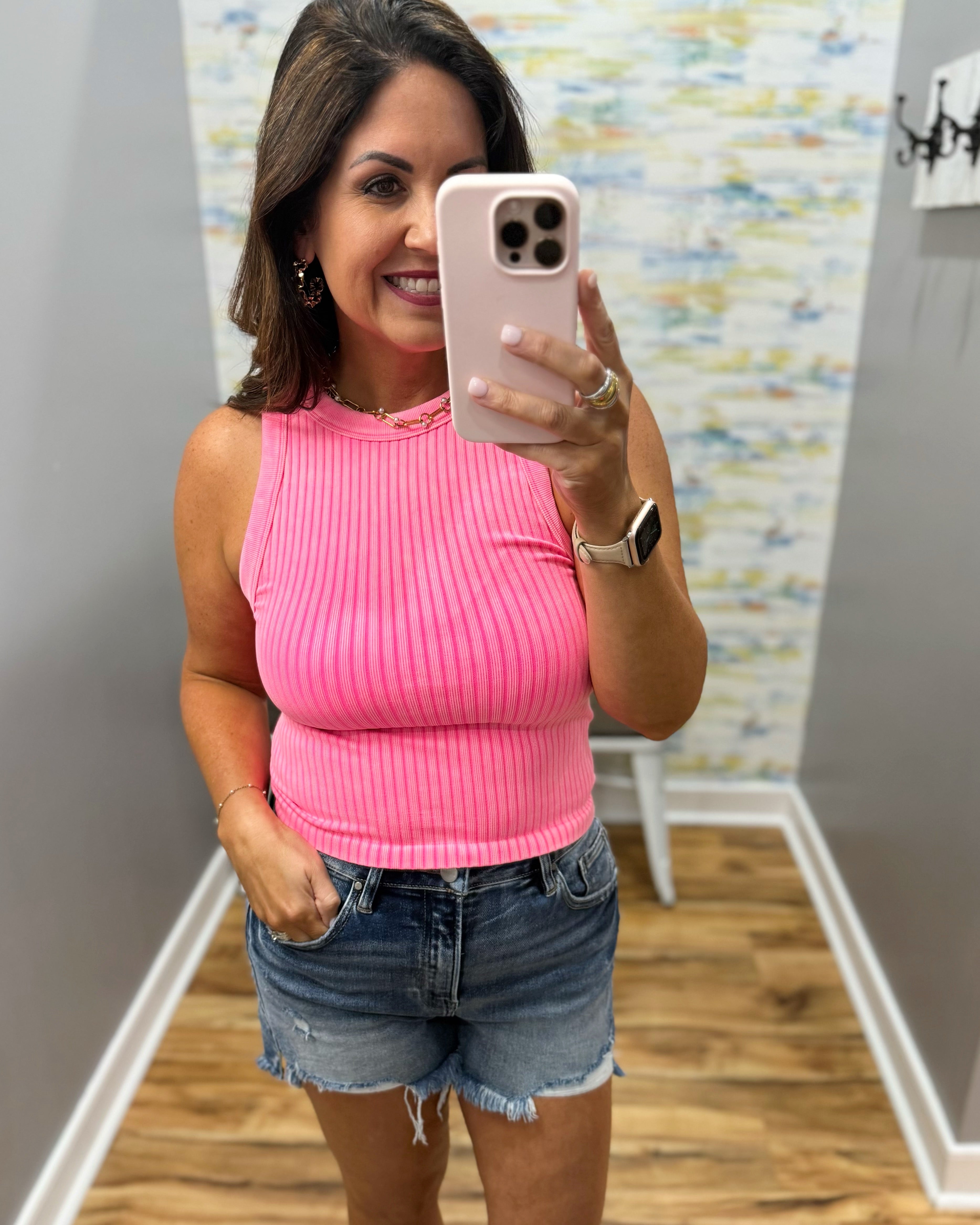 woman wearing neon coral tank.