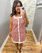woman wearing red and white stripe dress.