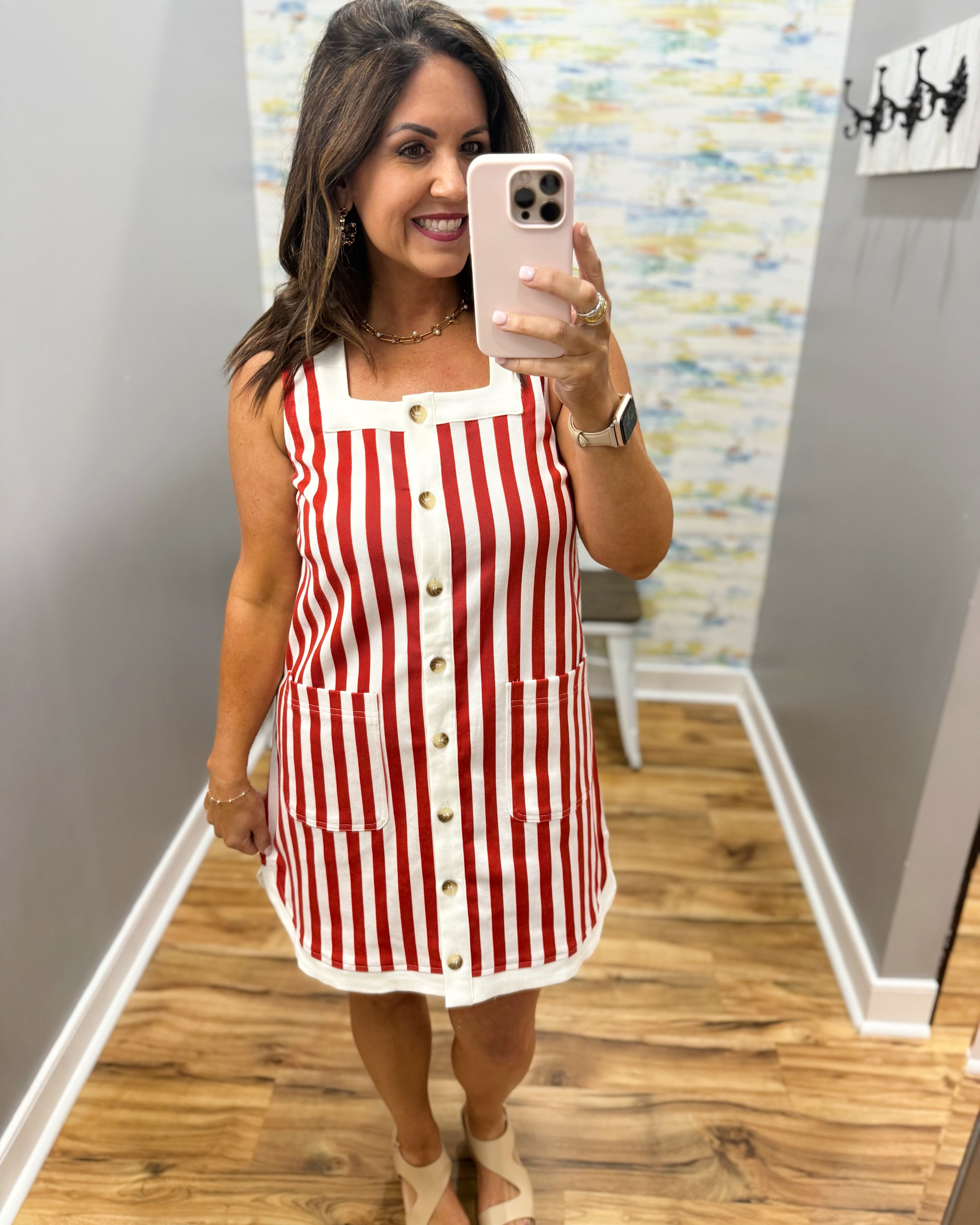 woman wearing red and white stripe dress.