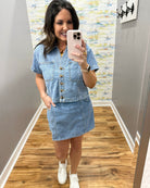 woman wearing denim top with matching denim skort