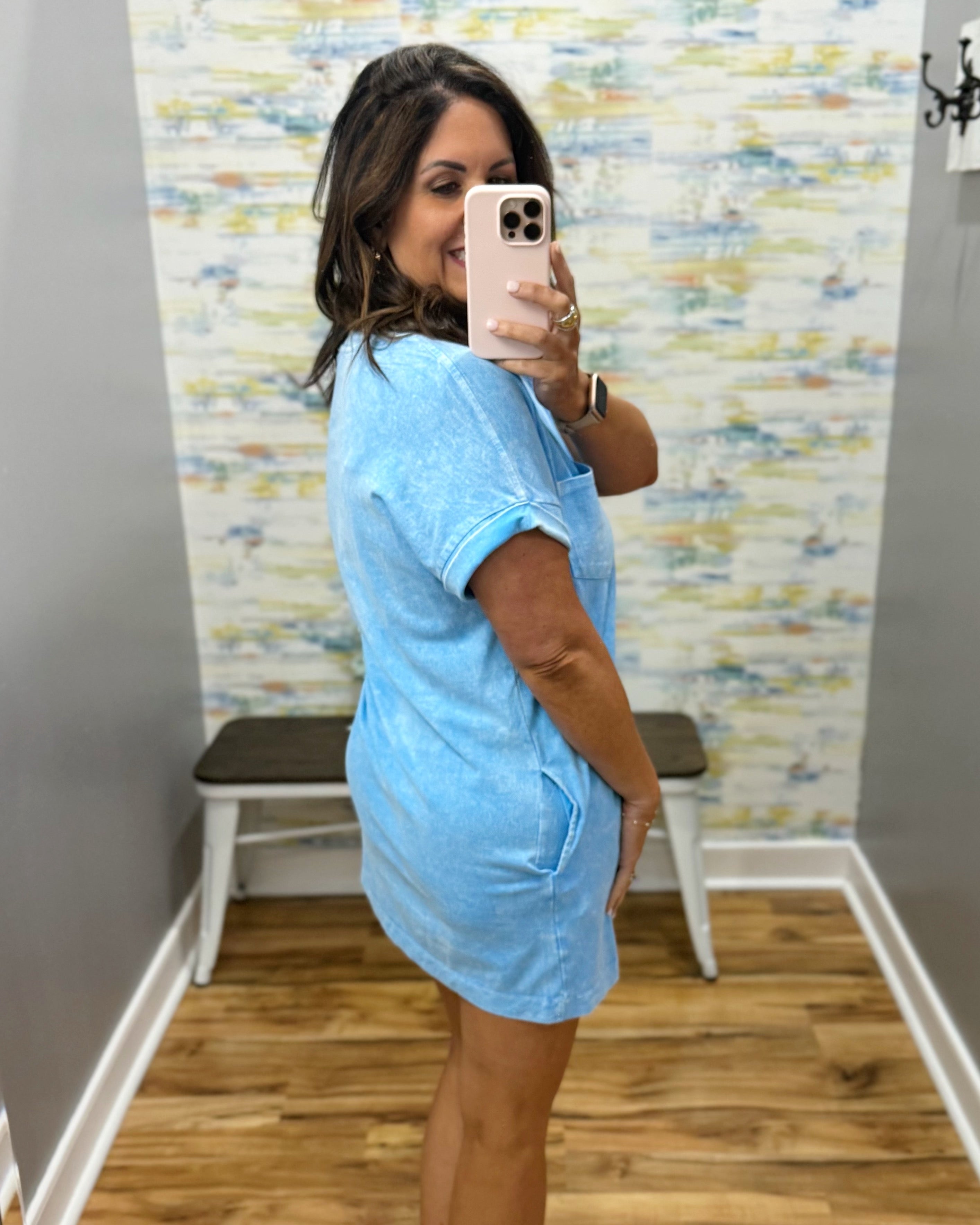 woman wearing deep sky blue t-shirt dress with sandals. 