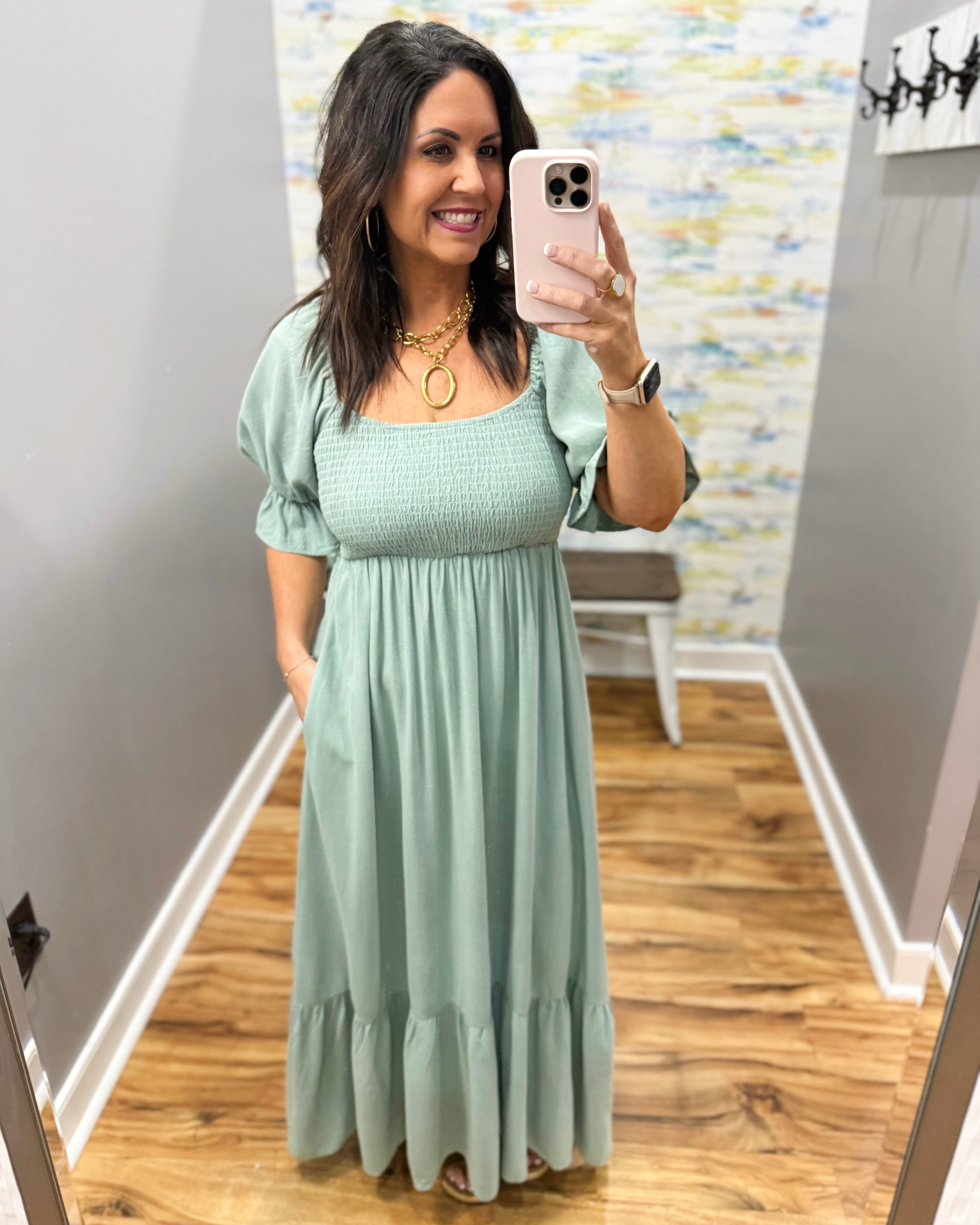 Woman wearing a light green dress.