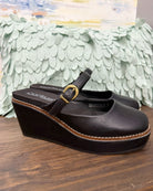Corkys Me Time Wedge in black. Retro-style, closed-toe platform shoe.