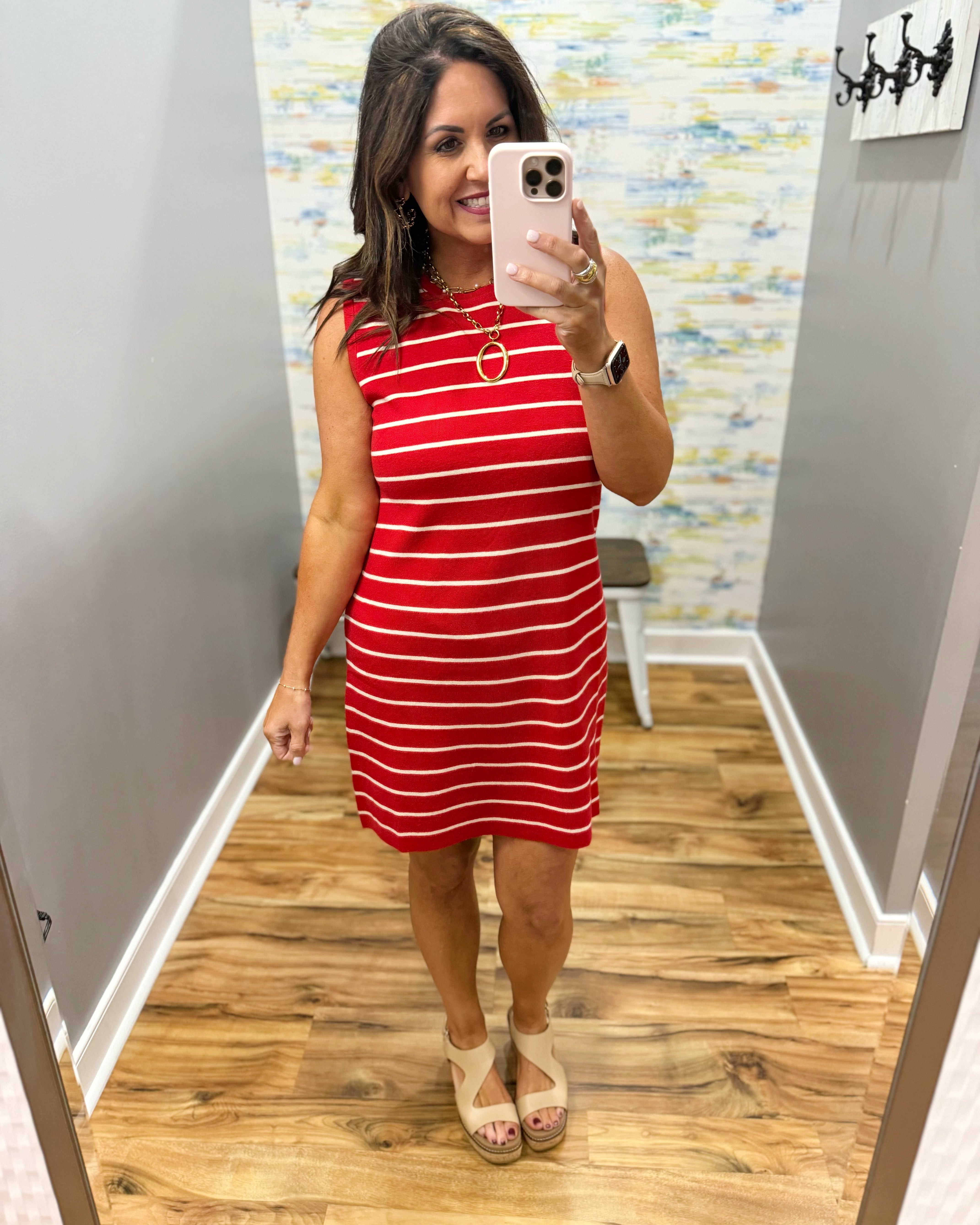 woman wearing a red and white stripe dress.