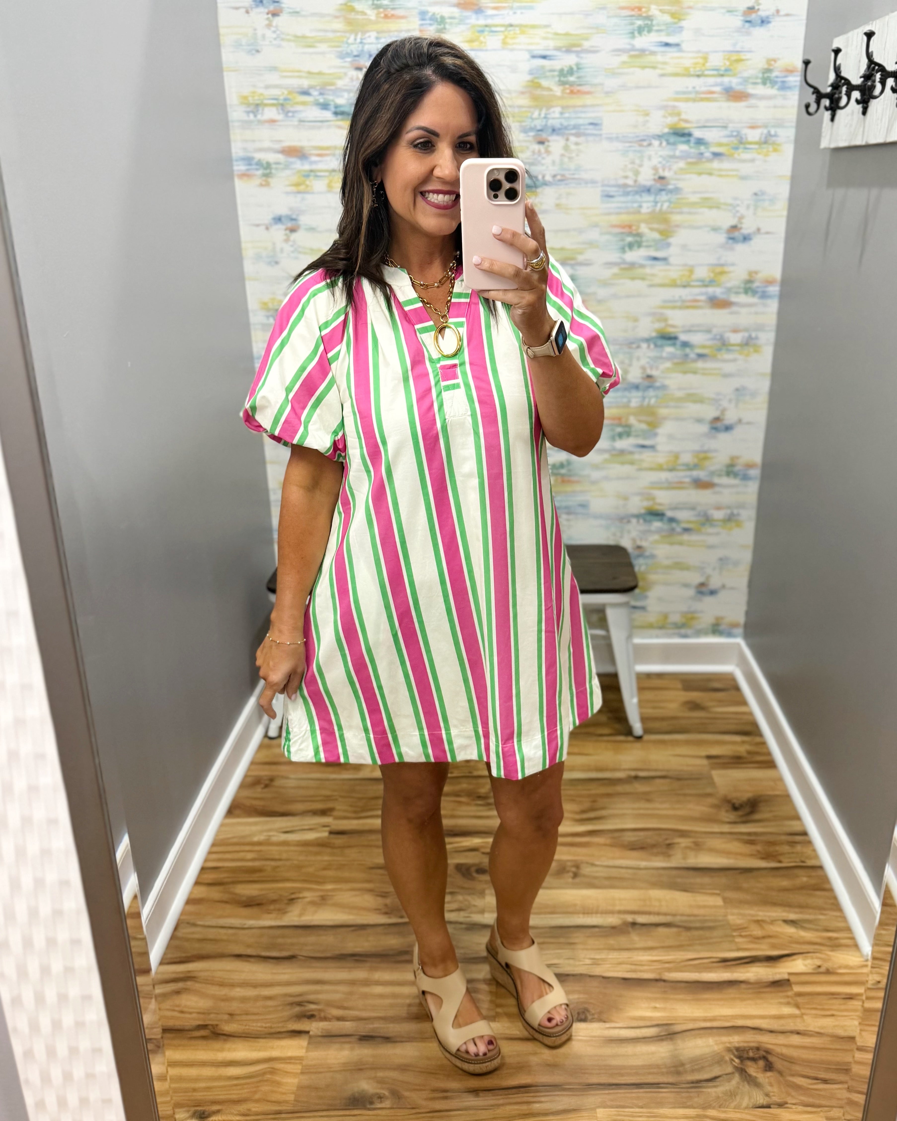 woman wearing a stripe dress.