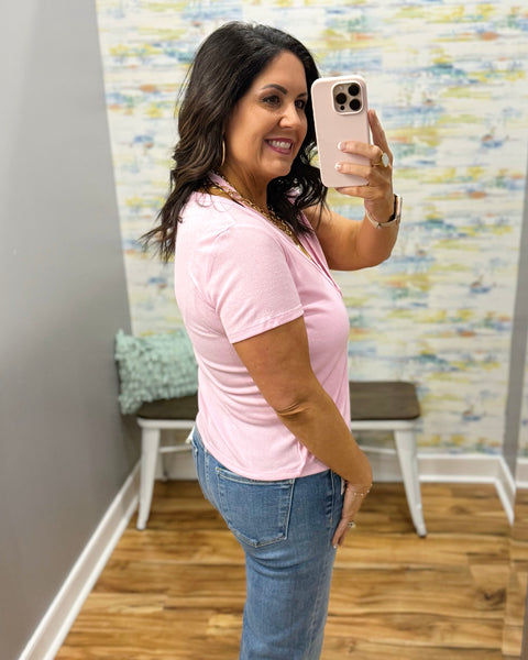 woman wearing pink top