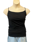 A black sleeveless camisole top with adjustable spaghetti straps and a scoop neckline, displayed on a mannequin wearing light wash denim shorts.