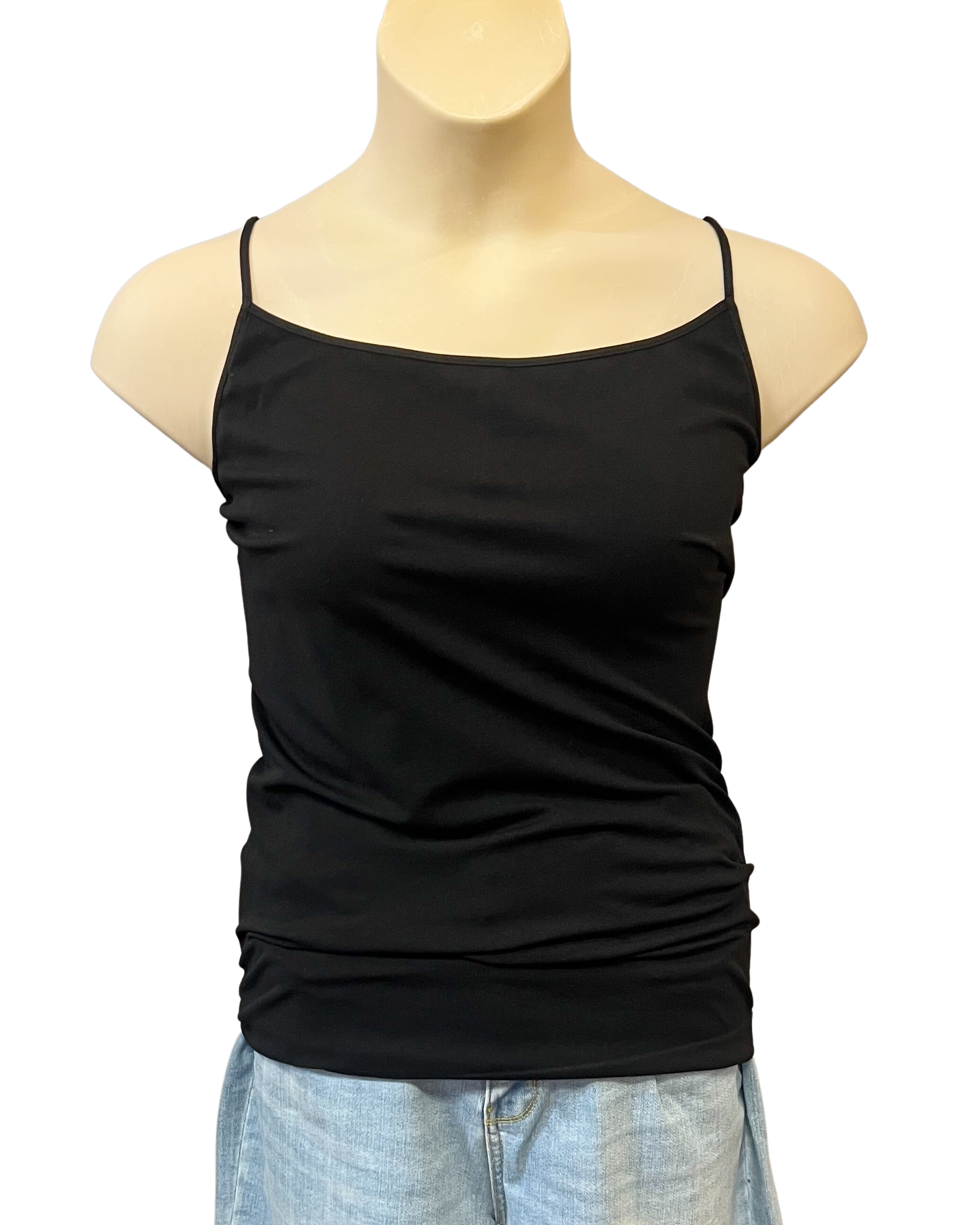 A black sleeveless camisole top with adjustable spaghetti straps and a scoop neckline, displayed on a mannequin wearing light wash denim shorts.